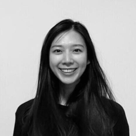 Portrait of Jennifer, a UX writer smiling at the camera.